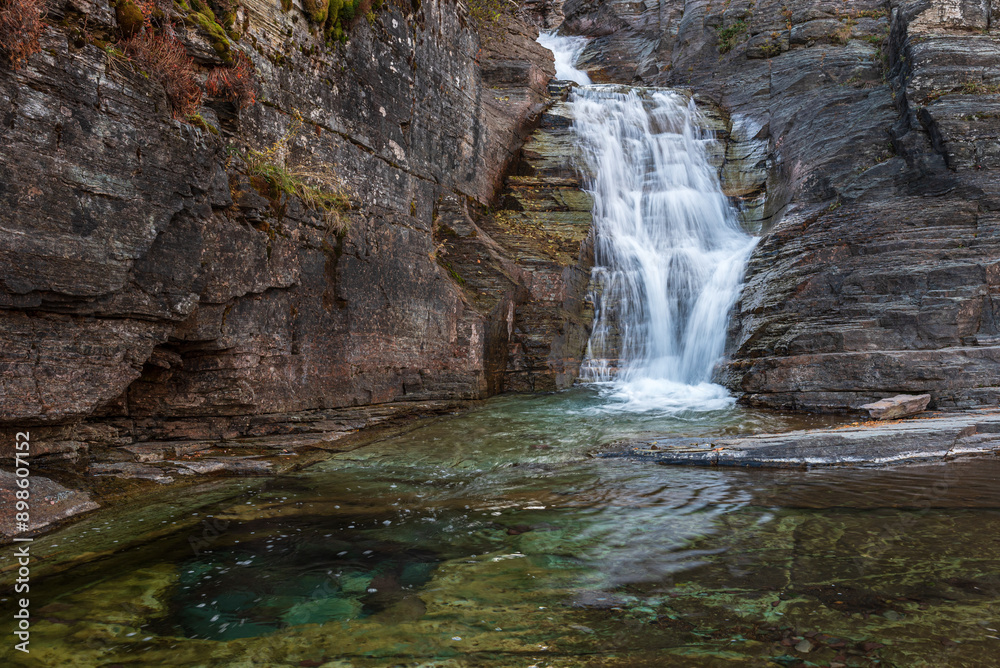 Naklejka premium fall, autumn, leaves, landscape, waterfall, stream, water, nature, river, cascade, forest, rock, flow, falls, natural, park, beautiful, wet, travel, glacier national park, national park, montana,