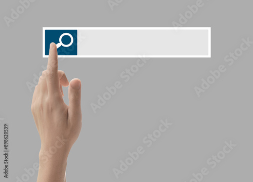 Man using search bar on virtual screen against light grey background, closeup