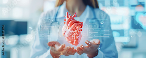 Hands of a doctor holding human heart. Health and cardiological diseases concept.