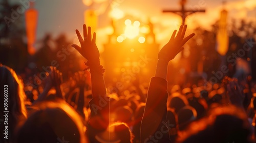 A vibrant sunset scene captures a cheering crowd with hands raised in celebration at a lively outdoor event or festival. 