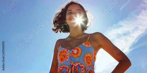 Bubbly Personality: A bubbly teen wearing a colorful sundress, her hands on her hips, her smile infectious.