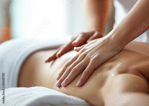 close up of hands making massage session in spa center salon with bokeh background