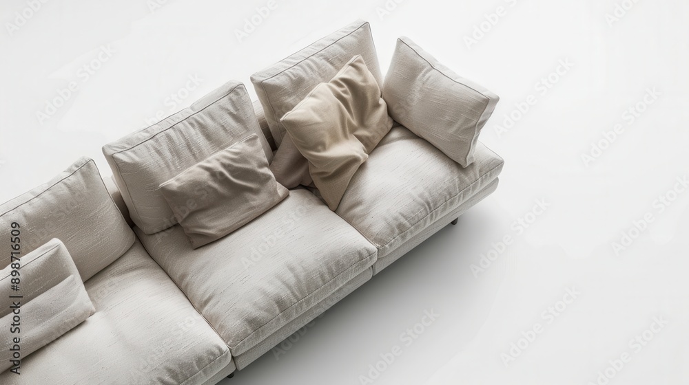Obraz premium A white modular sectional sofa with beige pillows sits in a modern studio, bathed in natural light. Generative AI
