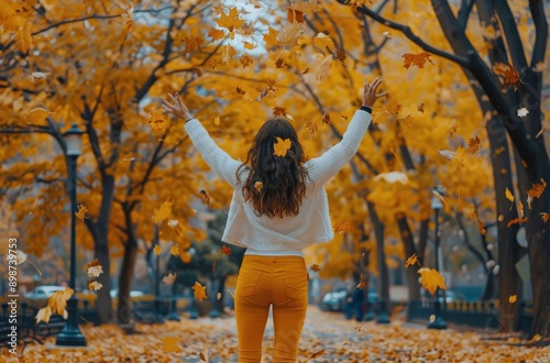 Woman in Yellow Pants Walking Through Leaves