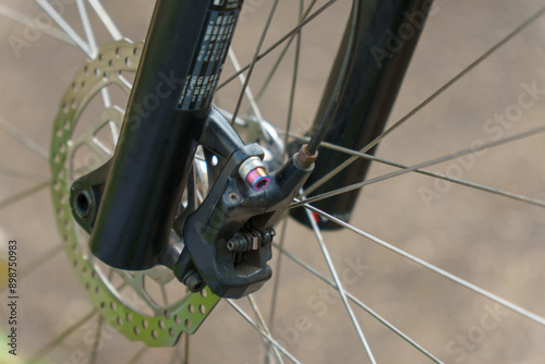 Modern mountain bike on the street. Details of a mountain bike in close-up.