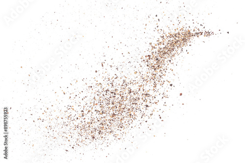 Fototapeta Naklejka Na Ścianę i Meble -  Minced black pepper, ground peppercorn pile flying isolated on white, macro