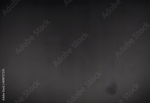 Dark grey velvet texture sample, gray satin screen  background, smooth, some waves, well enlighted photo