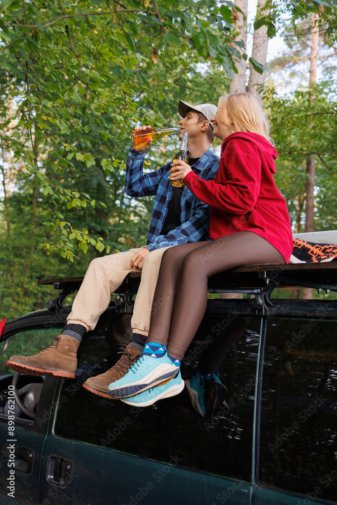 Van Roof Relaxation: Couple Enjoys Beer Van Roof Relaxation: Couple Enjoys Beer