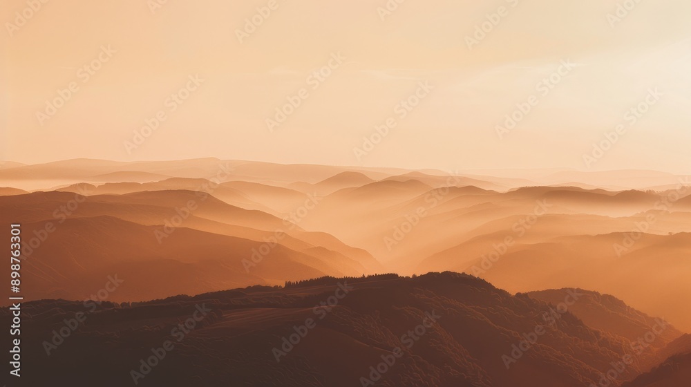 A breathtaking view of a mountain range bathed in the warm glow of the setting sun, with layers of mountains and fog creating a sense of depth and serenity. The image embodies tranquility, natural bea A breathtaking view of a mountain range bathed in the warm glow of the setting sun, with layers of mountains and fog creating a sense of depth and serenity. The image embodies tranquility, natural bea