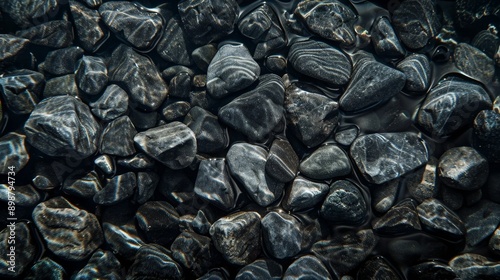 Anthracite pebbles underwater with reflections of light, aesthetic minimalist background