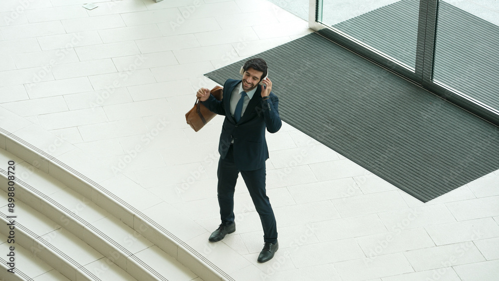 Fototapeta premium Professional business man talking to skilled executive manager while standing at door. Top view of manager calling colleague by using phone.while discussing about project plan. Changing job. Exultant.