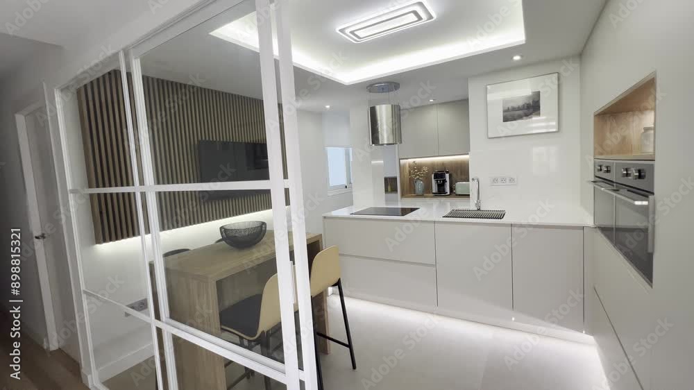 cocina de diseño con isla . zona de lavado y desayunado . almacenaje y electrodomesticos integrados 