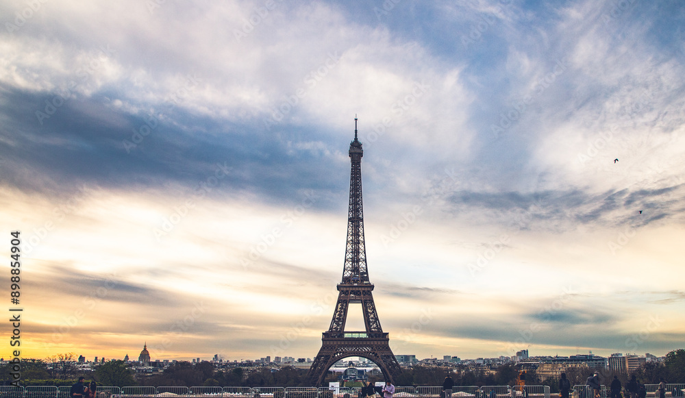 Naklejka premium PARIS, FRANCE - MARCH 30, 2024: Eiffel Tower seen from the Jardins du Trocadero in Paris, France. Eiffel Tower is one of the most iconic landmarks of Paris