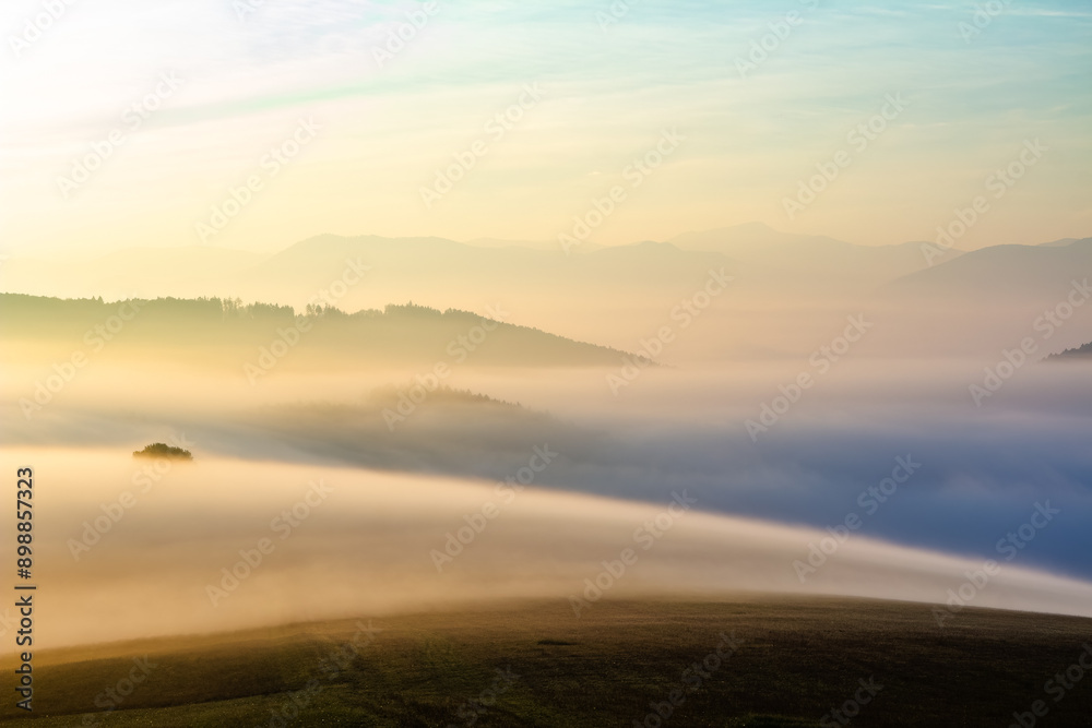 Summer landscape with mountains, shrouded in thick fog. Summer landscape with mountains, shrouded in thick fog.