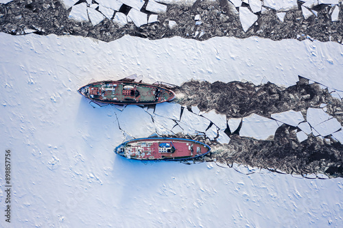 Icebreakers on river breaki...