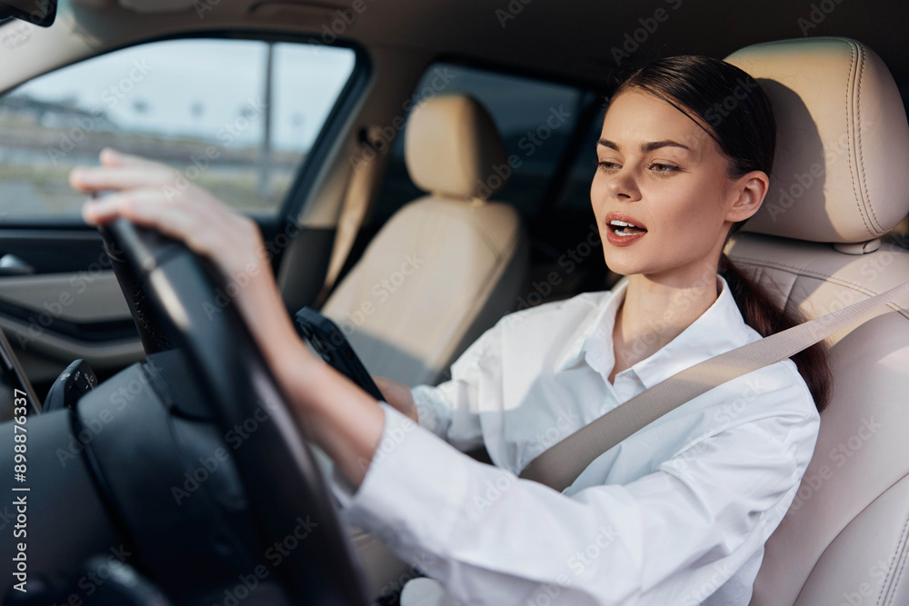 Woman, car, driver, steering wheel a woman sits in the driver's seat of a car, hands gripping the steering wheel as she looks directly at the camera, conveying confidence and focus Woman, car, driver, steering wheel a woman sits in the driver's seat of a car, hands gripping the steering wheel as she looks directly at the camera, conveying confidence and focus