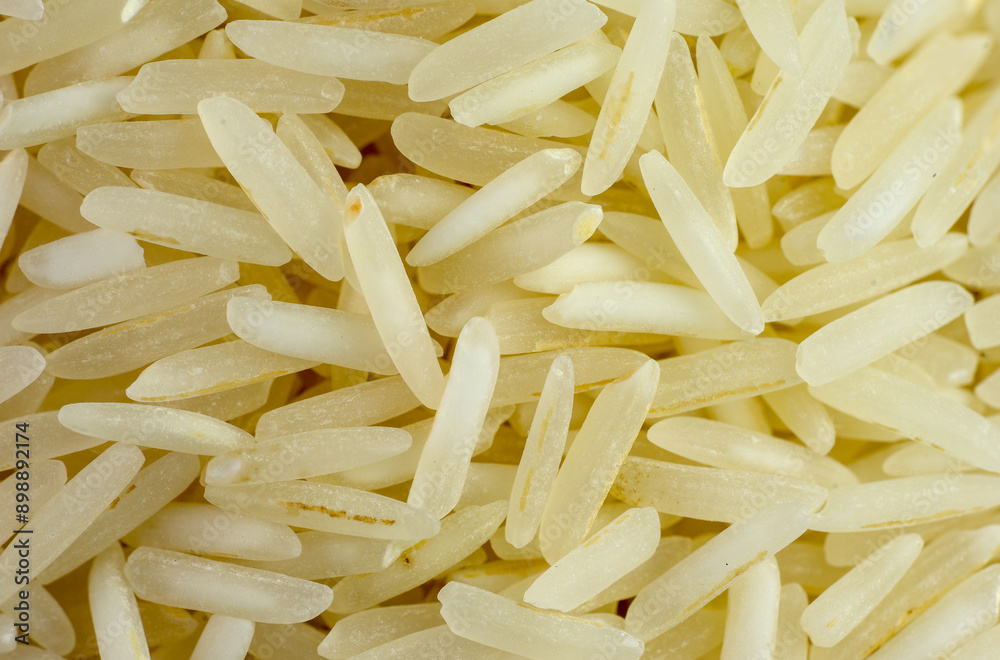 Fototapeta premium Macrophotograph of numerous basmati rice grains seen from the top in great detail.