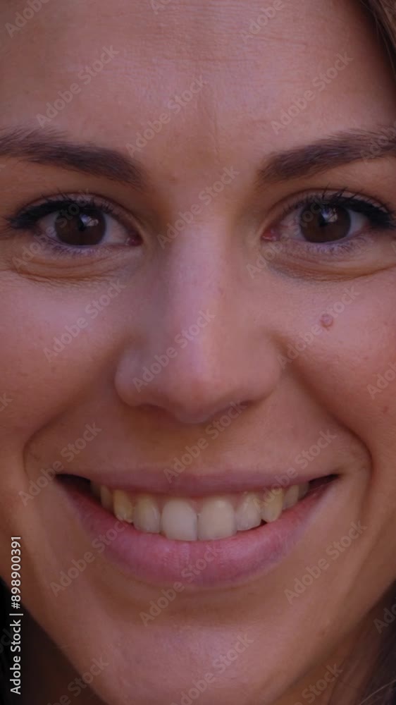Vertical Close up face of happy beautiful young European woman happy smiling on street. Female people with cheerful expression looking at camera in open air. Attractive girl posing for photo outdoor. Vertical Close up face of happy beautiful young European woman happy smiling on street. Female people with cheerful expression looking at camera in open air. Attractive girl posing for photo outdoor.