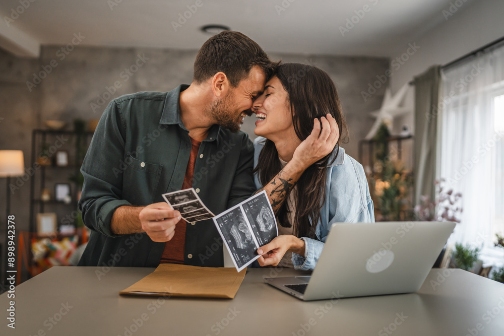 happy couple in love hold ultrasound picture of their first baby happy couple in love hold ultrasound picture of their first baby