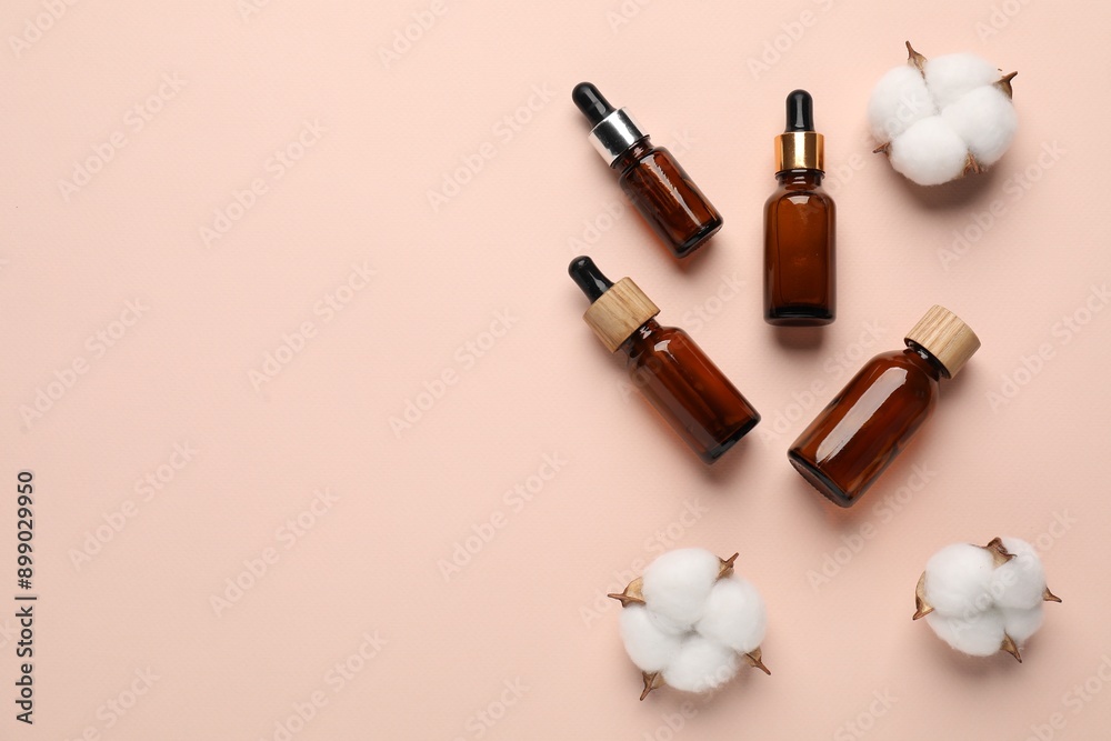 Different cosmetic products and cotton flowers on beige background, flat lay. Space for text Different cosmetic products and cotton flowers on beige background, flat lay. Space for text