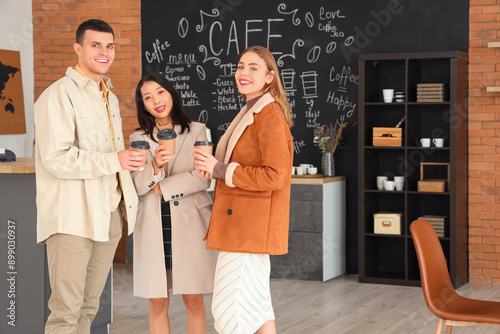 Young people with cups of coffee in cafe