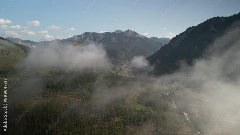 Aerial of Yankee Fork basin near Stanley Idaho through low clouds in summer Aerial of Yankee Fork basin near Stanley Idaho through low clouds in summer