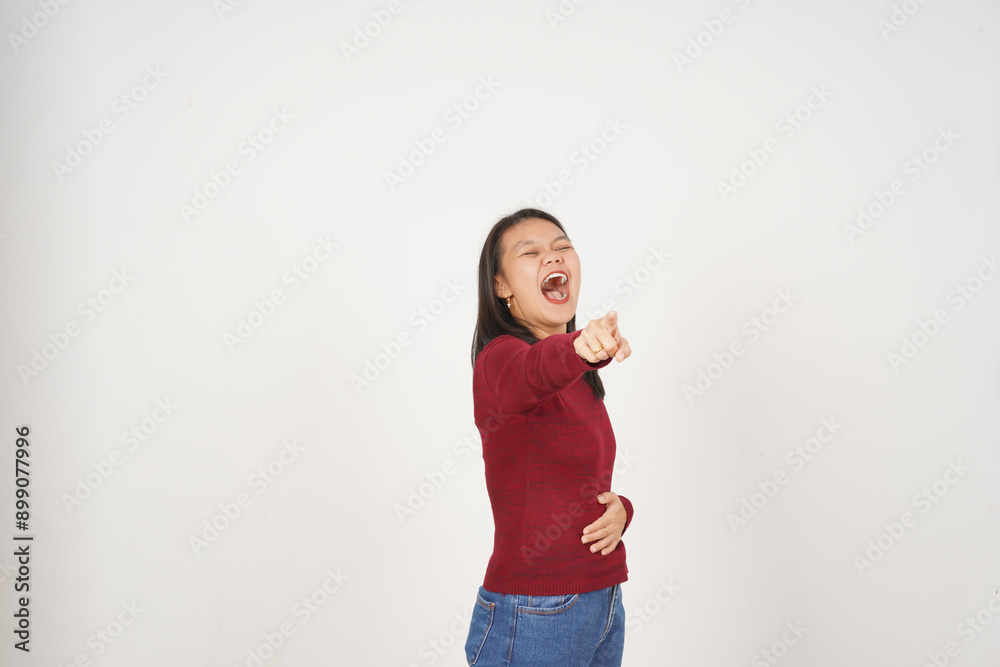 Young Asian woman pointing and laughing wearing Red t-shirt isolated on white background Young Asian woman pointing and laughing wearing Red t-shirt isolated on white background