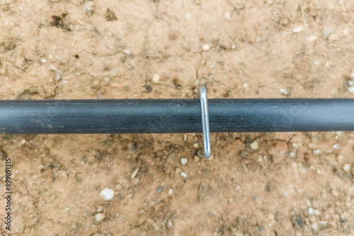 Obraz na płótnie U pins or hold down pegs installed over pipe w salonie