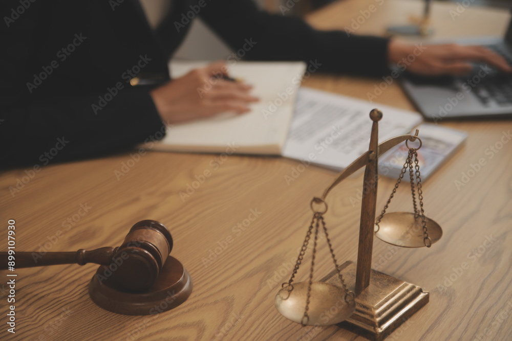 Judge gavel with Justice lawyers having team meeting at law firm background. Concepts of Law and Legal services. Judge gavel with Justice lawyers having team meeting at law firm background. Concepts of Law and Legal services.
