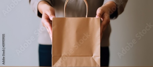 Paper Bag Held Out by Person