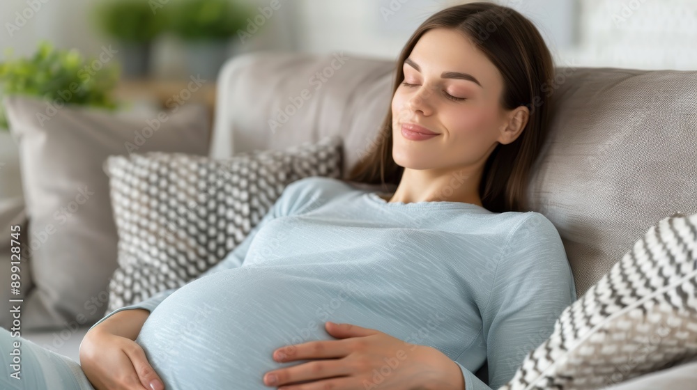 Peaceful pregnant woman resting on a comfortable couch at home, symbolizing calm and anticipation for motherhood. Peaceful pregnant woman resting on a comfortable couch at home, symbolizing calm and anticipation for motherhood.
