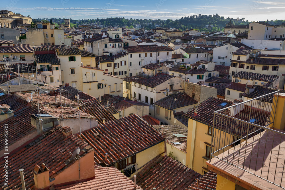 Rooftops of Florence in the afternoon sun with hills in the distance Rooftops of Florence in the afternoon sun with hills in the distance