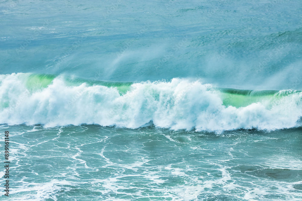 Fototapeta premium Wave splashing close-up. Crystal clear sea water, in the ocean in San Francisco Bay, blue water, pastel colors.