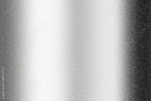 A polished, brushed metal plate with a smooth, silver texture
