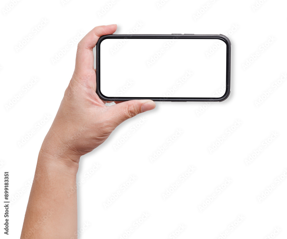 A hand holding a mockup smartphone with empty transparent screen in horizon landscape view. Background cutout. A hand holding a mockup smartphone with empty transparent screen in horizon landscape view. Background cutout.