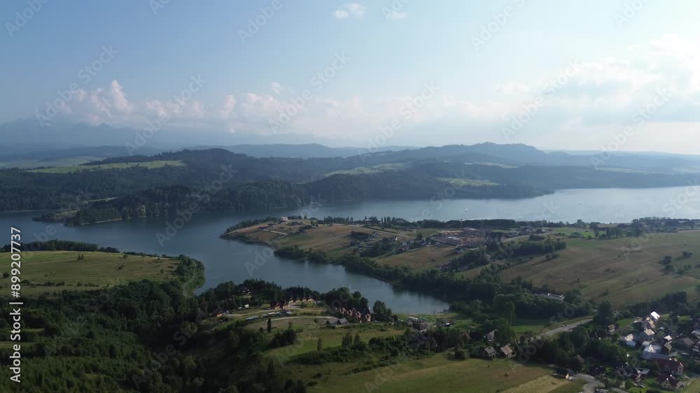 Beautiful aerial view of Lake Czorsztyn and nearby village Beautiful aerial view of Lake Czorsztyn and nearby village
