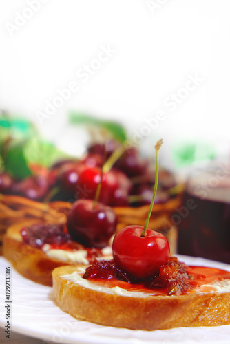 Bruschetta with cherry jam. Appetizer with ricotta cheese, cream cheese, berry jam. Toast, sweet snack for breakfast