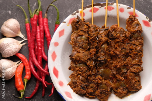 Clam Satay. Sate Kerang. Made from clams, chili, garlic, salt, spices. Blood clams are a type of clam commonly eaten by East and Southeast Asians. Tegillarca granosa. Indonesian food. photo