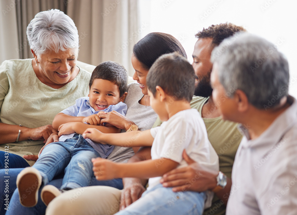 Grandparents, family and kid smile with home, fun and bonding together in lounge with laughing. Care, love and support with generations, happy people and young boys on living room sofa with tickle Grandparents, family and kid smile with home, fun and bonding together in lounge with laughing. Care, love and support with generations, happy people and young boys on living room sofa with tickle