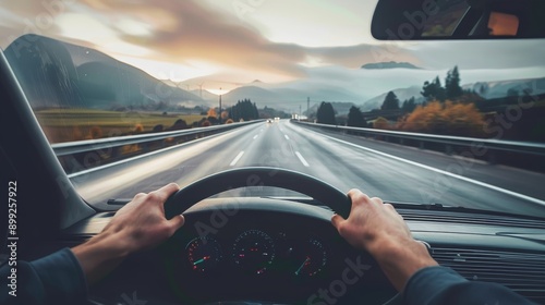 The driver point-of-view perspective from a driving car on a highway asphalt, captures the sense of motion and travel