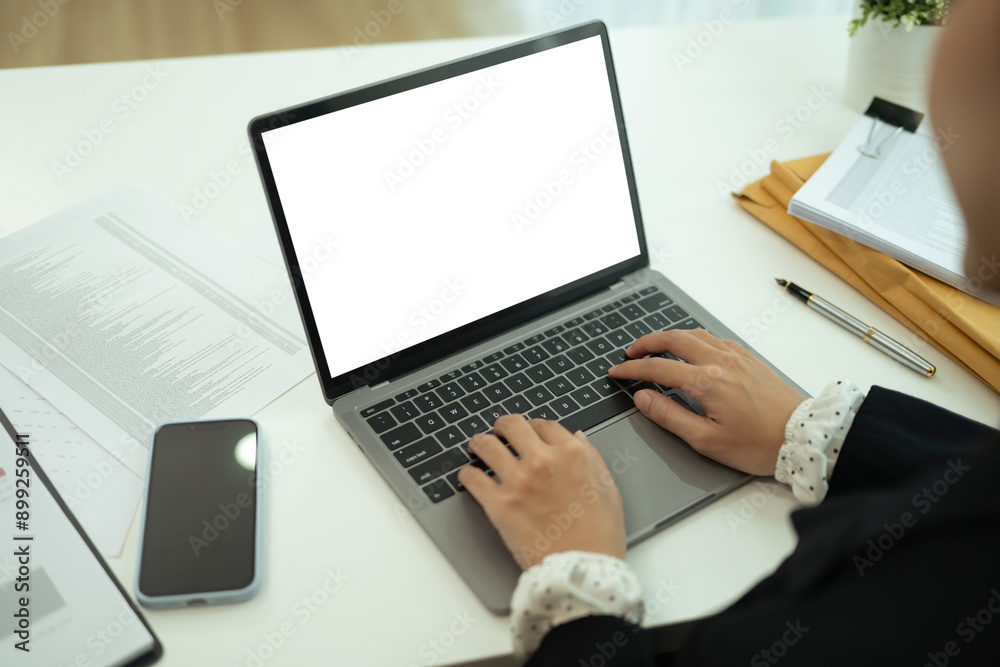 Close up young entrepreneur typing on laptop keyboard and working with document at desk Close up young entrepreneur typing on laptop keyboard and working with document at desk