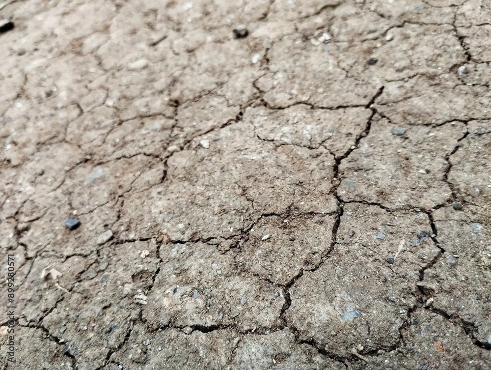 Close up shoot of grey brown dry cracked soil no water there Close up shoot of grey brown dry cracked soil no water there