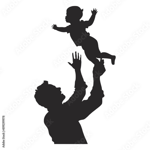 Silhouette of a father throwing his baby in the air. Joyful moment of fatherhood and childhood. 