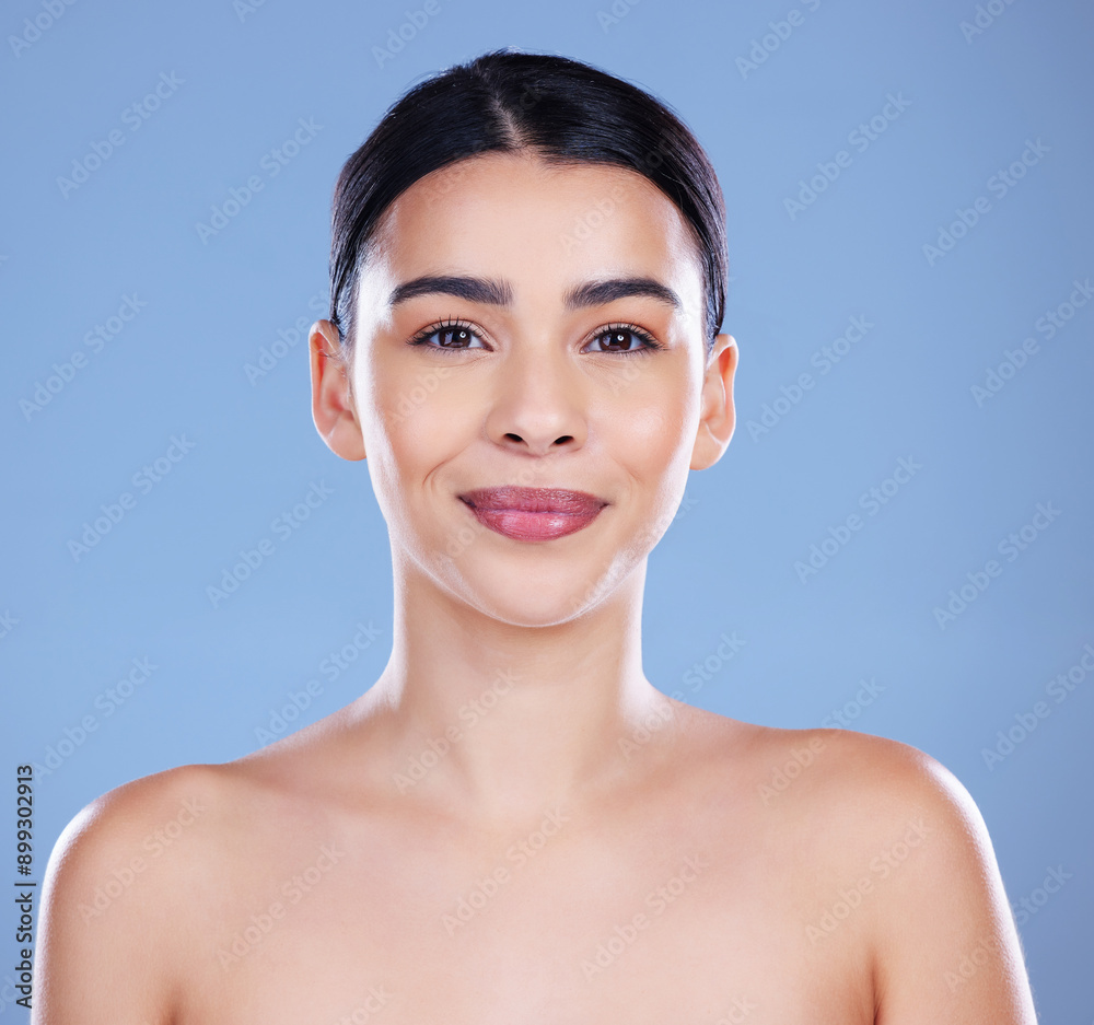 Woman, smile and portrait in studio for skincare, cosmetics and confidence in beauty. Female person, dermatology and happy on blue background for transformation, aesthetic and spa treatment for glow Woman, smile and portrait in studio for skincare, cosmetics and confidence in beauty. Female person, dermatology and happy on blue background for transformation, aesthetic and spa treatment for glow