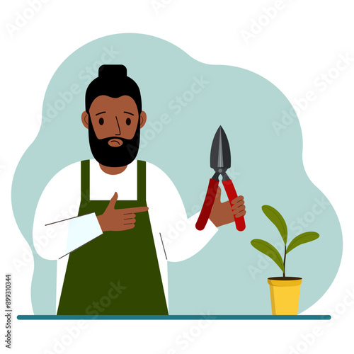 A gardener is a man in working clothes, he has a pruner in his hand. Vector flat illustration