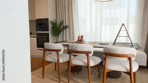 Wallpaper Mural A chic kitchen in an expensive private villa in Dubai, illuminated by sunlight from huge windows Torontodigital.ca