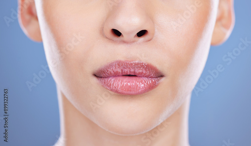 Принти на полотні Face, woman and pouting lips for cosmetic, beauty or filler with closeup in blue background