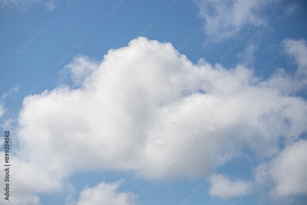 Sky background with clouds. White clouds against a blue sky. Sky background with clouds. White clouds against a blue sky.