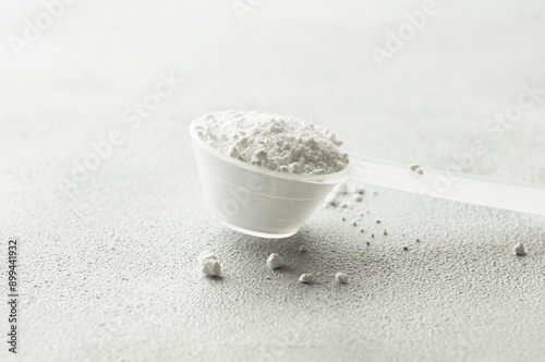 Photography Powdered magnesium oxide or sulfate in a medicine spoon, water soluble drug grou