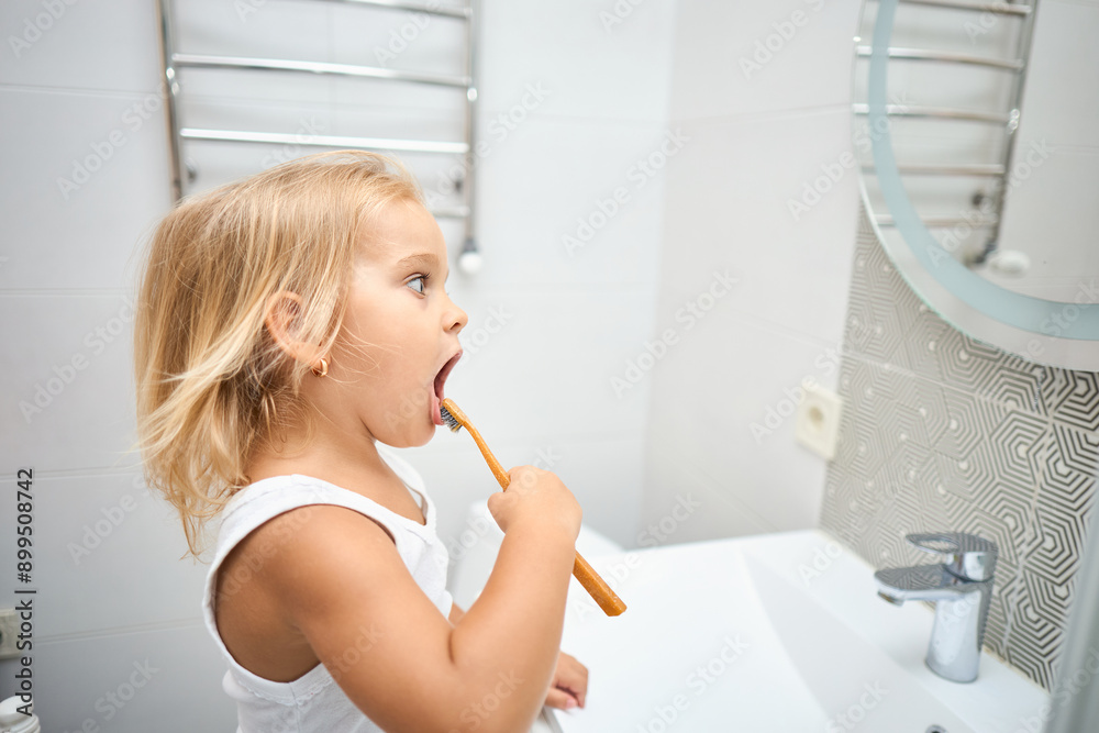Morning routine, smiling happy child brushing teeth with toothbrush. Morning routine, smiling happy child brushing teeth with toothbrush.